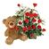 Teddy Bear & Roses. A charming teddy bear and and arrangement of tender red roses with greens in basket.. Barcelona